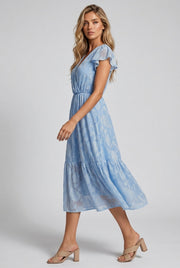 Léonie Floral Midi Dress — Light Blue — AI-generated studio left-side walking view
