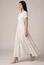 Creamy White Embroidery A- Line Dress — White — AI-generated studio left-side walking view