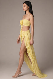 Sienna Rosette Maxi Dress — Yellow — AI-generated studio left-side walking view