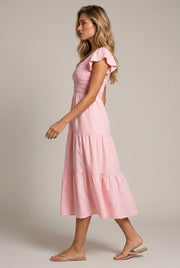 Juliette Tiered Midi Dress — Pink — AI-generated studio left-side walking view