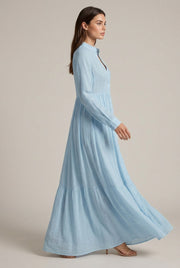 Élodie Shirt Maxi Dress — Sky Blue — AI-generated studio left-side walking view