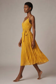 Women's Polka-Dot Suspender Midi Dress — Yellow — AI-generated studio left-side walking view