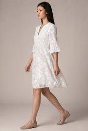 Womens White Floral Embroidery Elegant Dress — White — AI-generated studio left-side walking view